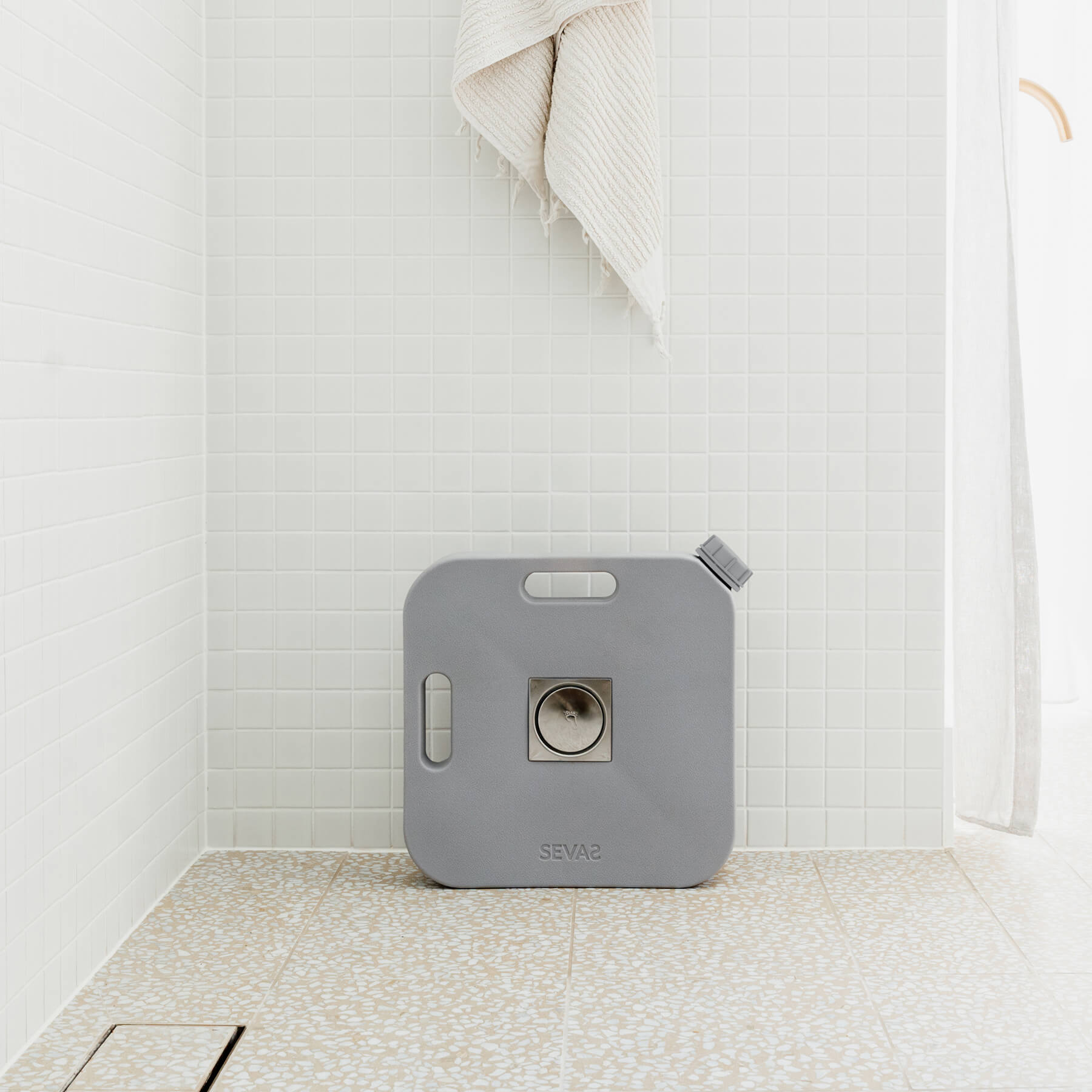 Sevas Water Catcher In White Tile bathroom